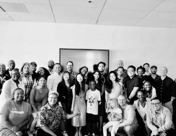 Group photo of diverse people at a community event in Las Vegas.