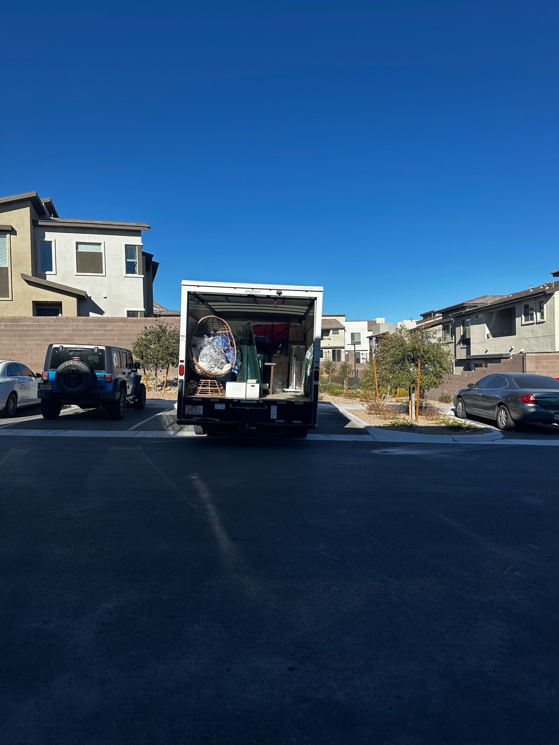 A moving truck loaded with personal belongings